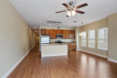 View of living room & kitchen from front door as y