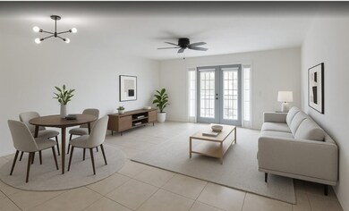 The living  room /dining area is virtually staged
