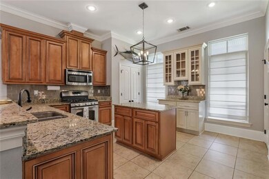 Entertainers kitchen featuring beautiful wood cabi