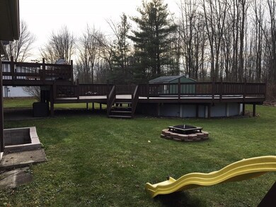 Huge deck and above ground pool with firepit area 