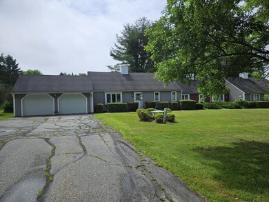 Long driveway with attached garage