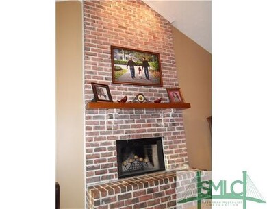 Den/Family/Great Room. Wood-burning fireplace.