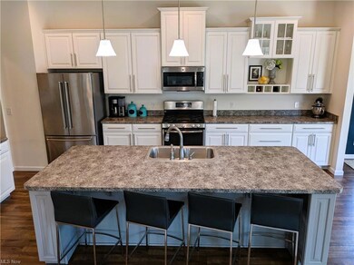 Large island with seating, stainless steel applian