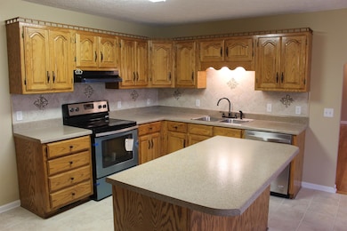 Kitchen is approx 15x20, has tiled flooring  & New appliances