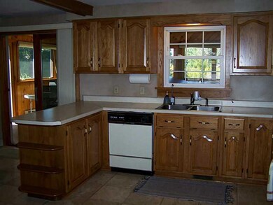 Kitchen. Hickory cabinets abound the inviting kitc