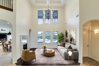 Formal living area with recently updated pass through stone fireplace surround has tons of windows that provide excellent natural light. (virtually staged)