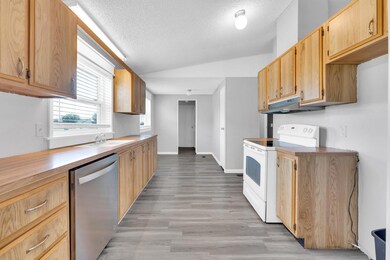Kitchen with a textured ceiling, stainless steel d