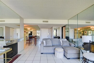 Living room featuring a notable chandelier, light