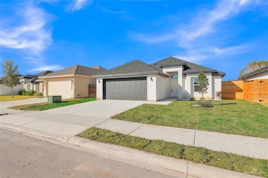 View of front of property with concrete driveway, brick siding, and a garage