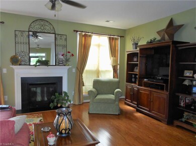 Gas logs fireplace with blower, hardwood flooring and ceiling fan will make this favorite gathering spot.