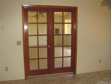 French doors leading from dining room to bonus/gam
