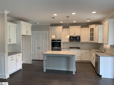 Kitchen with window above sink walks through to fo