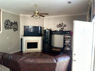 Living room featuring ornamental molding and ceili