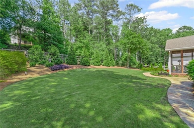 The flat, grassy backyard is a true highlight with