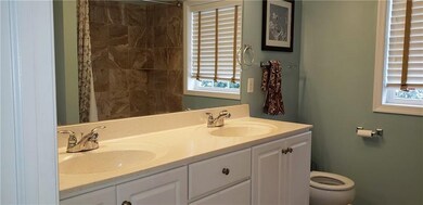 Double sink master bath, see reflection of tile sh