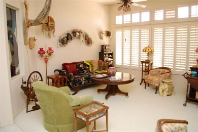 Great Room / high ceiling and shutters