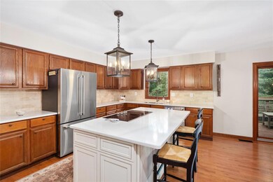 Perimeter cabinetry is oak, in good condition and 