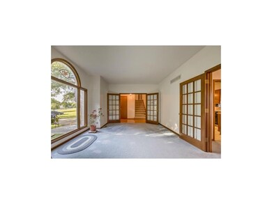 French doors from entry to living room with large 