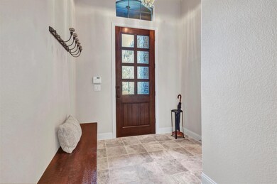 Gorgeous 8 foot glass and wood door greets you and