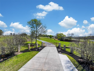 Scenic rural property with a long driveway leading