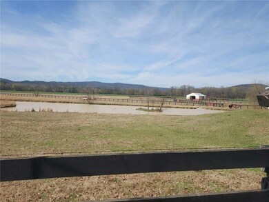 View of yard featuring a view of rural / pastoral area and a mountain view