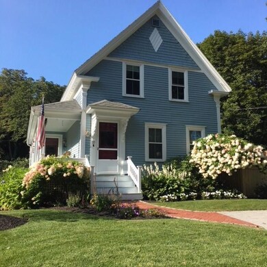 FRONT OF THE HOUSE ANCHORED BY...