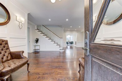Entrance foyer featuring dark hardwood / wood-styl