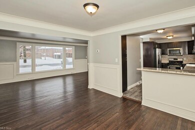Living room opens up to a casual dining space next