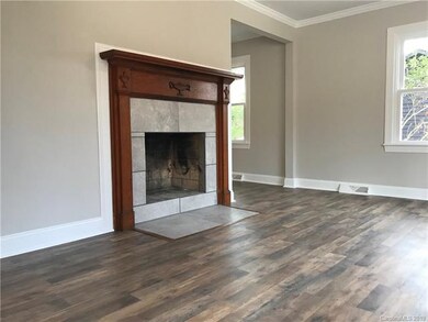 Original wood mantel has been restored to original