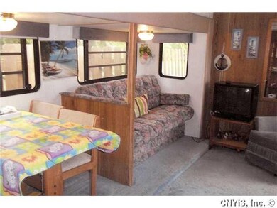 Living Room. Couch folds to bed. Behind TV wall is