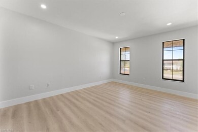 Empty room with recessed lighting, light wood finished floors, and baseboards