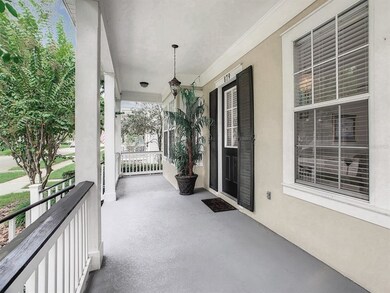 The front porch is the whole width of the house.
