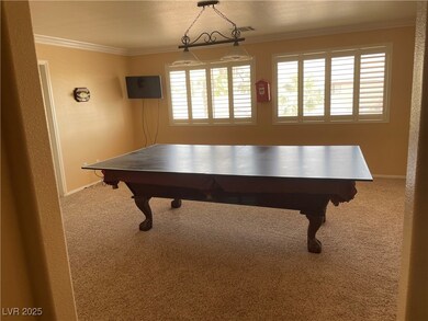 Recreation room with carpet floors and crown moldi