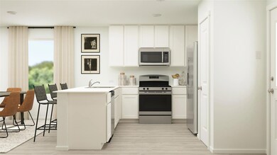 Kitchen with sink, white cabinetry, kitchen penins