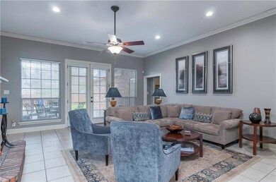 The sleek living area features a gas log fireplace
