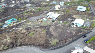 Large cleared pad and driveway to right along boundary with neighboring parcel.  Lot includes an area below pad.