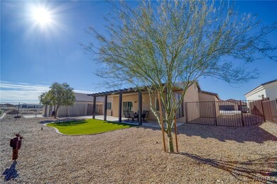 Rear view of property with a pergola and a patio a