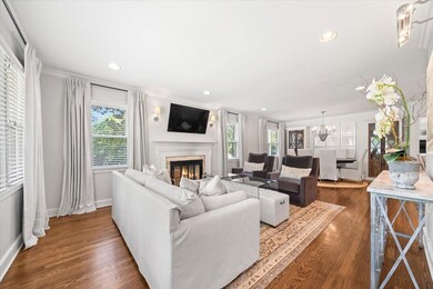 Living room featuring crown molding, a glass cover