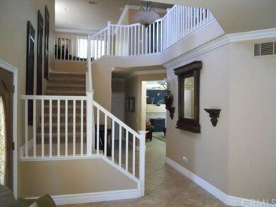 Elegant Entry area with volume ceilings