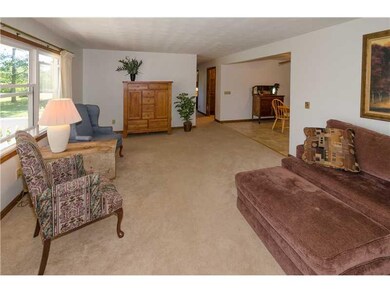Living Room. Another view looking onto breakfast/dining area; open floor plan.