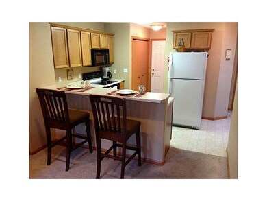 Kitchen. A charming kitchen offers breakfast bar t