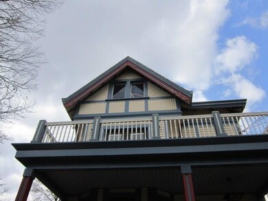 View of the front upper porch and the attic.