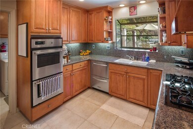 Double drawer dishwasher, garden window, tile floors and laundry room nearby