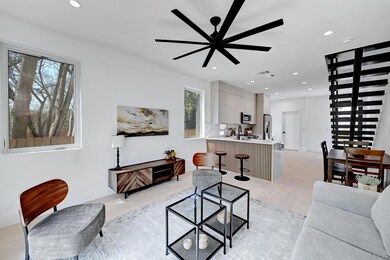 Living area featuring baseboards, visible vents, 