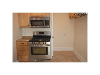 Newer stove and built-in microwave.
