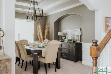 Dining room with updated lighting fixture, slight 