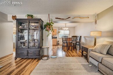 Living room with hardwood / wood-style floors, a c