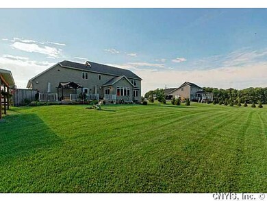 Backyard. Lovely acre lot located in a beautiful n