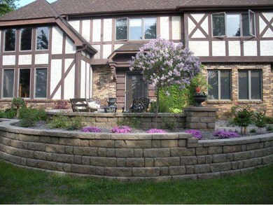 Lush gardens and manicured yard welcome you home!