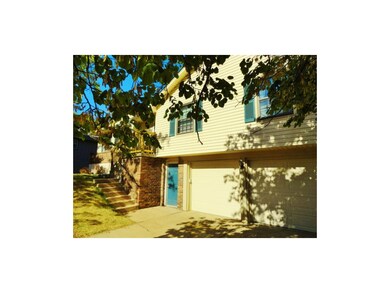 6209 Hallet front of home with walk-out basement.
